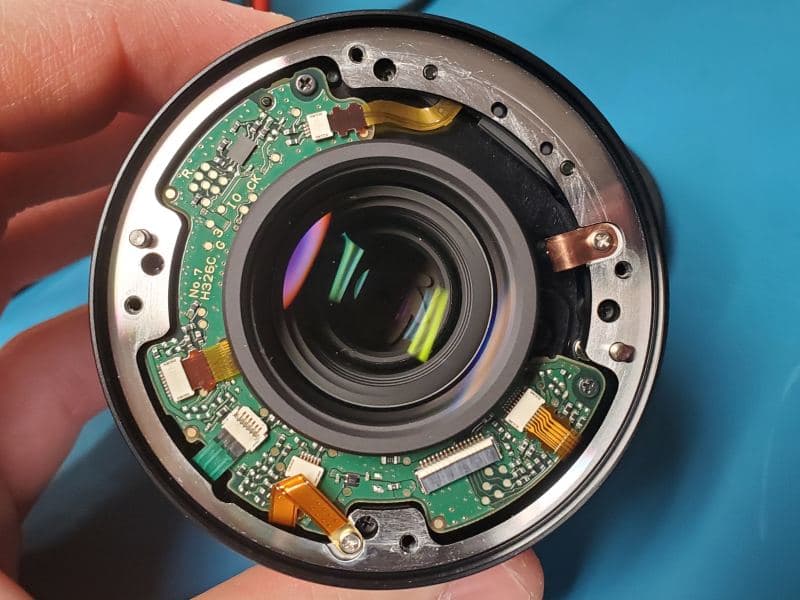 Repairing modern camera lenses exposes design complexity